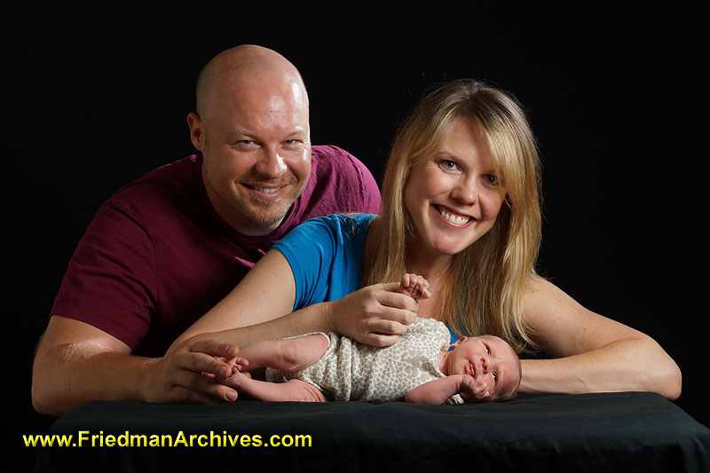 parents,newborn,motherhood,pregnancy,infant,family,baby,joy,holding,girl,mother,week old,proud,birth,fatherhood,,mother,father,family portrait,